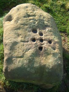 Boundary Stone where coins were left in holes filled with vinegar