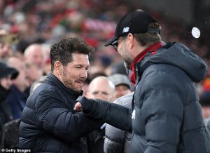 Diego Simeone (left) of Atlético Madrid and Jürgen Klopp (right) of Liverpool bump elbows before the match