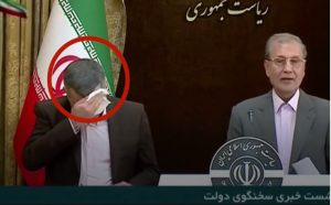 Iraj Harirchi, Iran's deputy health minister, sweating during a news conference. He later tested positive for Covid-19 (courtesy BBC News)
