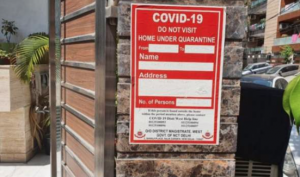 Sign outside a Delhi house (BBC)